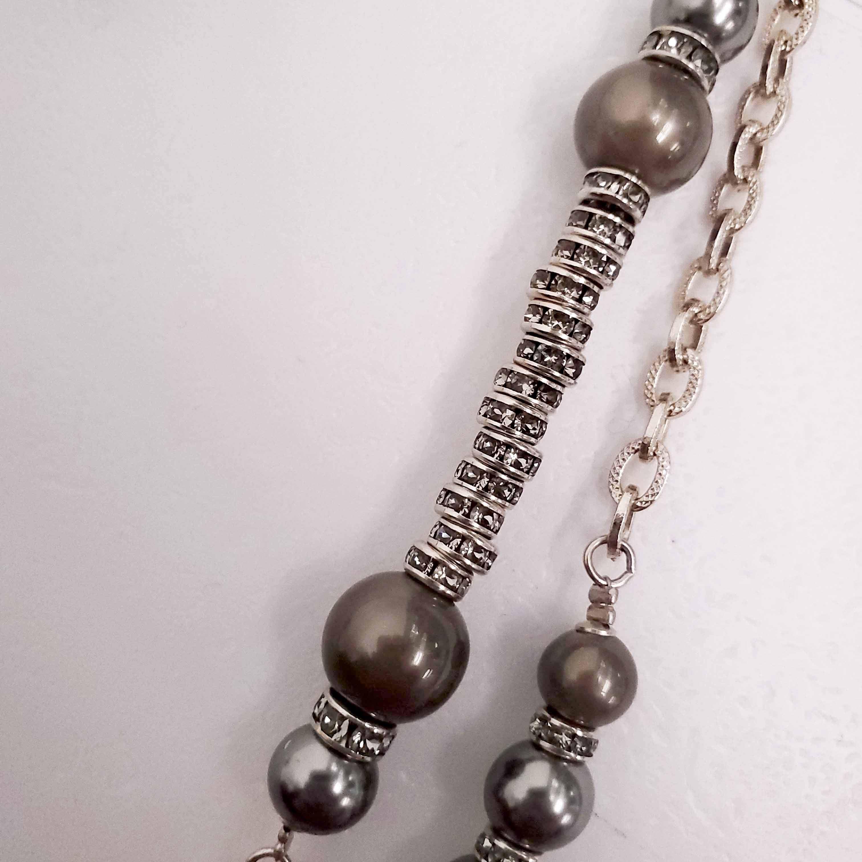 CHANEL GOLD, BRONZE, AND GREY LAYERED PEARL NECKLACE WITH CRYSTAL LOGOS